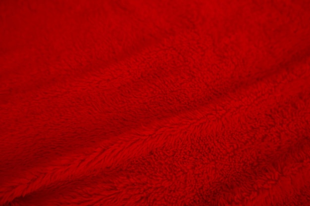 Rote saubere Wolltextur Hintergrundlicht natürliche Schafwolle rote nahtlose Baumwolltextur aus flauschigem Fell für Designer Weihnachtstag Nahaufnahme Fragment roter Wollteppich x9