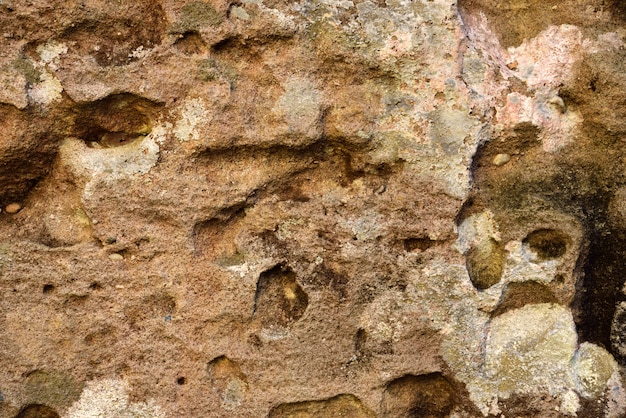 Foto rote und braune steinbeschaffenheit und -hintergrund