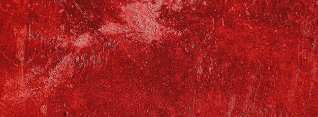 Rote wändegruseliger hintergrundbetonwand verputzter roter kratzerhintergrundgrunge textur