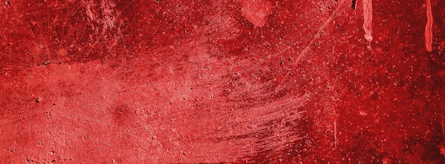 Rote wändegruseliger hintergrundbetonwand verputzter roter kratzerhintergrundgrunge textur