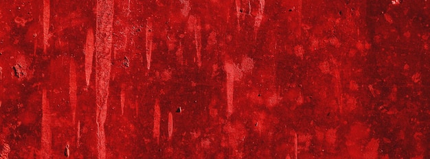 Rote wändegruseliger hintergrundbetonwand verputzter roter kratzerhintergrundgrunge textur