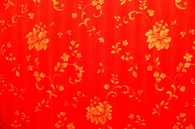 Roter abstrakter Hintergrund mit goldenen Blumen