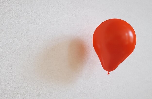 Roter Ballon an einer Wand 3D-Rendering