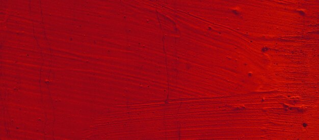 Roter Hintergrund mit Betonstruktur. Zementrote Putzwände haben glatte und raue Betonoberflächen