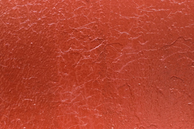 Roter rostiger metallischer hintergrund mit farbigen flecken