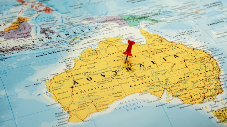 Roter Stift gesetztes vorgewähltes an der Australien-Karte. - Wirtschafts- und Regierungskonzept.