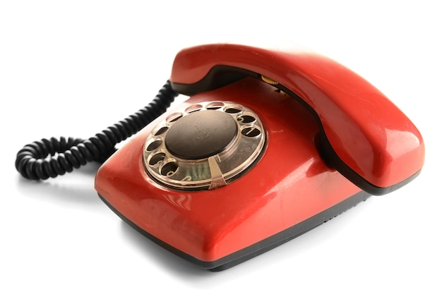 Rotes Retro-Telefon getrennt auf Weiß