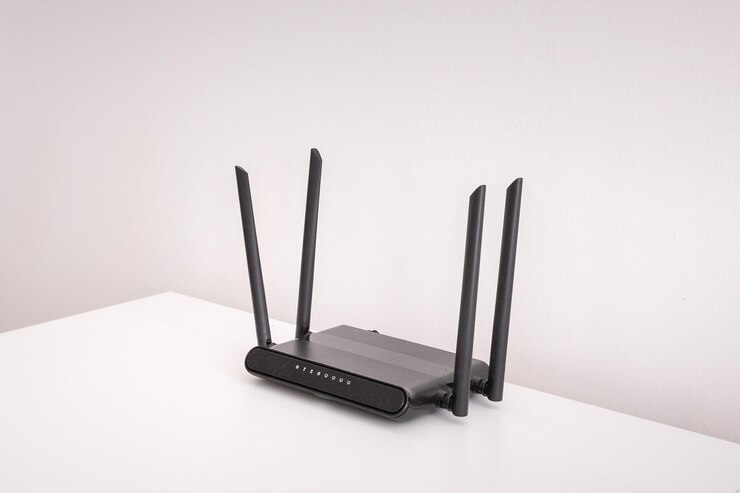 Foto router wifi negro en mesa blanca en el interior