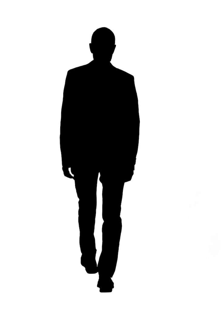 Foto rückensilhouette eines mannes, der in einem anzug läuft und gekleidet ist
