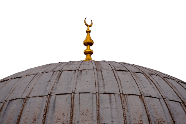 Rustikale Kuppel einer alten Moschee mit einem Halbmond, lokalisiert auf weißer, islamischer Architektur