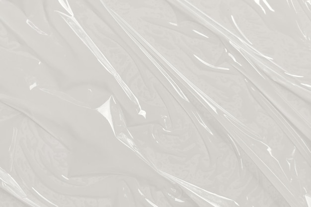 Saco de celofane plástico transparente sobre fundo branco Textura de película de plástico branco Fonte Textura de saco de plástico branco