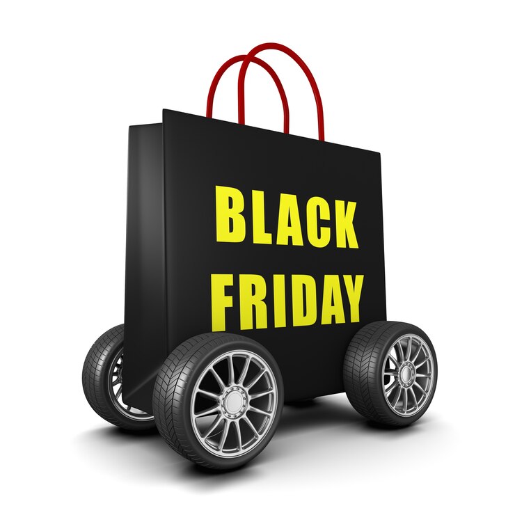 Foto sacola de compras preta sobre rodas com texto black friday isolado