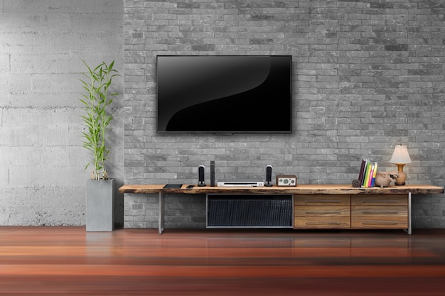 Sala de estar led tv en la pared de ladrillo con mesa de madera