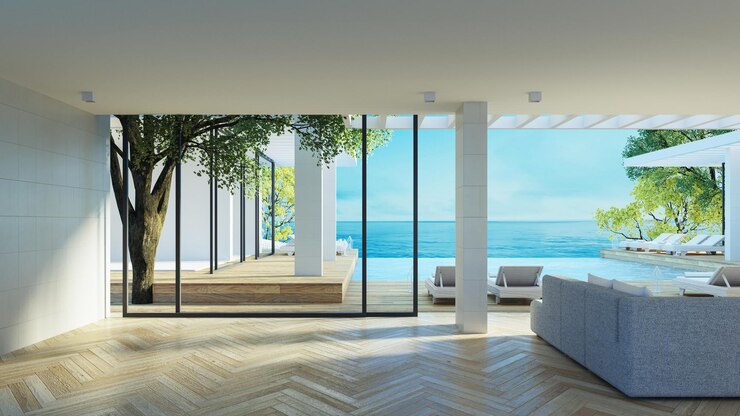 Sala de estar de lujo en la playa e interior con vista al mar - 3D rendering