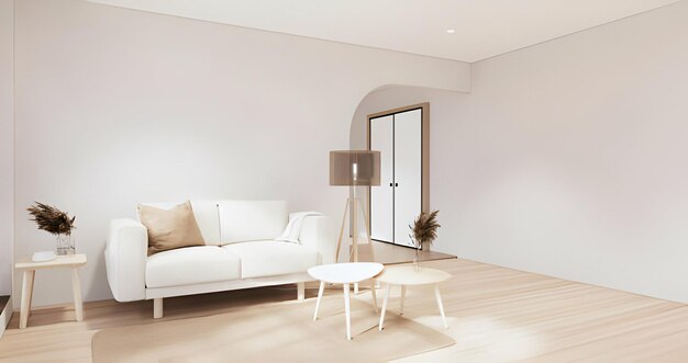 una sala de estar con un sofá blanco y una lámpara en la mesa