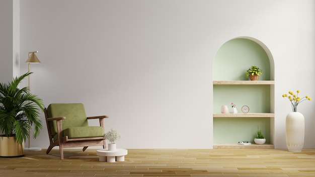 La sala de estar tiene un sillón verde y una decoración en una pared de color blanco vacía