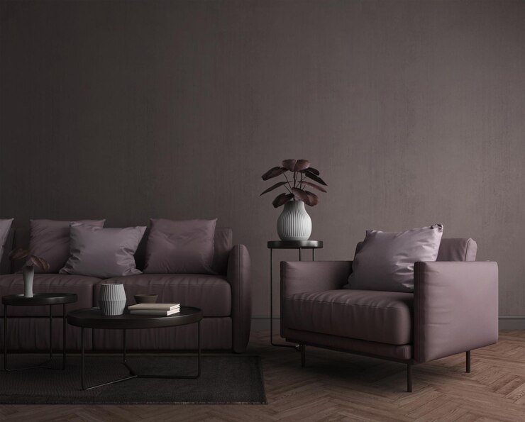 Sala de estar en tonos oscuros de estilo moderno con sillón y planta