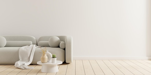 Sala de estar vacía con sofá gris y mesa sobre fondo de pared blanco vacío