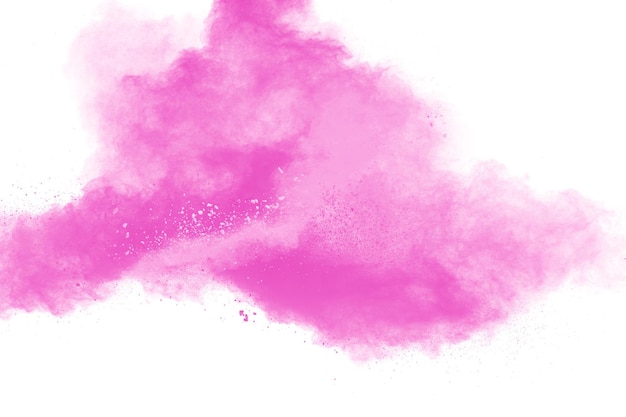 Foto salpicaduras de partículas de polvo rosa sobre fondo blanco. salpicaduras de polvo rosa.