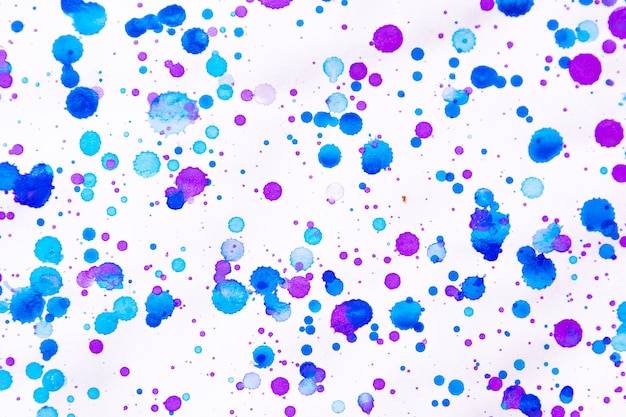 Foto salpicaduras de pintura de color azul y púrpura