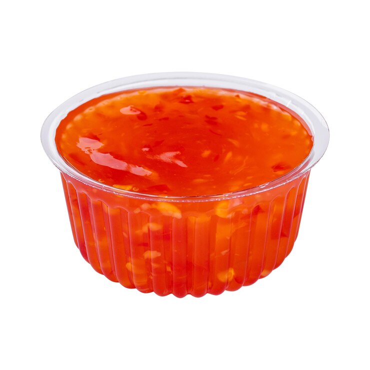 Salsa agridulce de naranja aislada en blanco