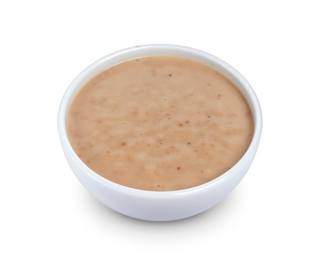 Salsa de sésamo. Tahini aislado en blanco