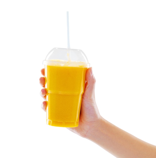 Salud en tu mano Foto de estudio de una mujer sosteniendo un batido de frutas aislado en blanco