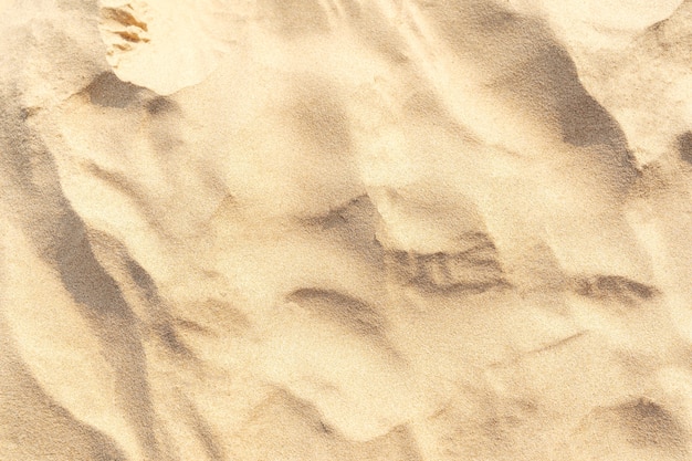 Sand am Strand als Hintergrund. Hellbeige Meersand-Texturmuster, Sandstrand-Texturhintergrund.