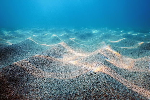 Sandiger Meeresboden, Unterwasserhintergrund, Unterwasserblauer Ozean