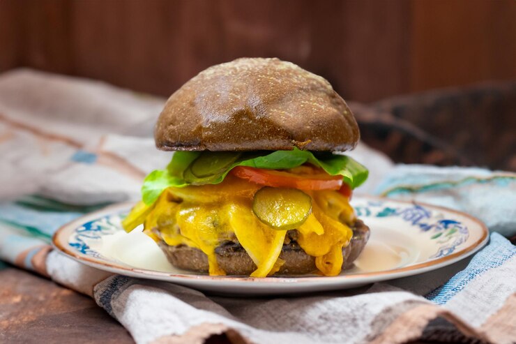 Foto sándwich tradicional de hamburguesa rústica con verduras de queso cheddar y pan australiano en creatividad