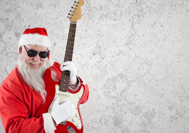 santa claus con gafas de sol tocando la guitarra