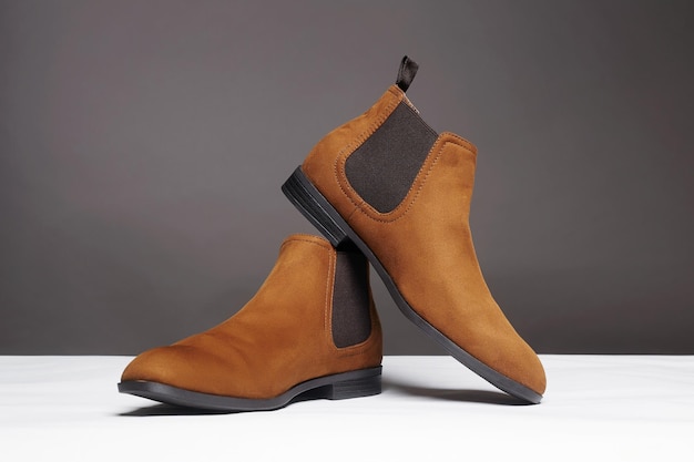 Sapatos elegantes da moda botas masculinas ainda vida