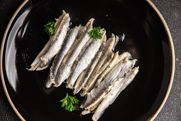 Sardellen-Sardine-Fischfilet-Meeresfrüchte-Mahlzeit-Essen auf dem Tisch kopieren Sie Raum-Lebensmittel-Hintergrundoberseite