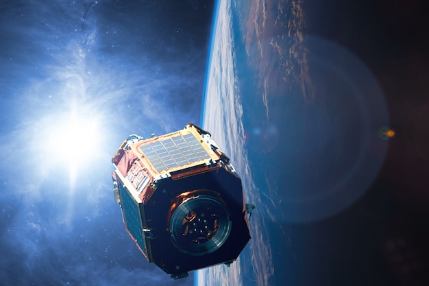 Un satélite en el espacio sobre earh está orbitando el planeta tecnología futura b. Elementos de esta imagen proporcionada por la NASA