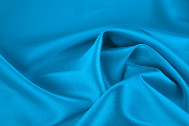 Satin Stoff, Nahaufnahme. Klassische blaue Farbe, einfarbig.