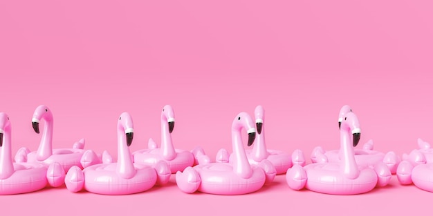 Satz aufblasbare Flamingos auf rosa Hintergrund