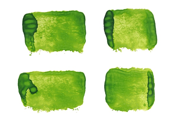 Satz grüne aquarellstriche lokalisiert auf weißem hintergrund