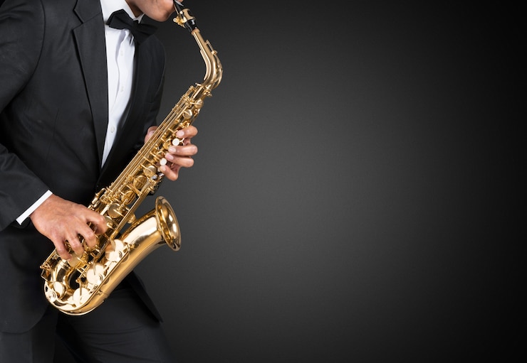 Foto saxofonista de jazz americano negro. vintage. tiro del estudio.