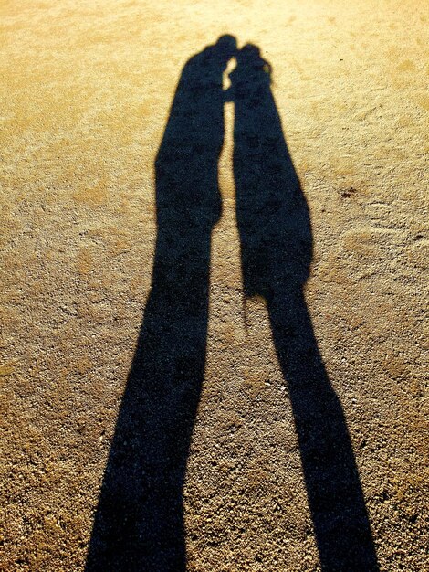 Foto schatten von menschen auf dem boden