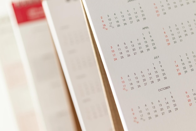 Schließen Sie herauf Kalenderseitendaten und Monatshintergrundgeschäftsplanungstermin-Besprechungskonzept