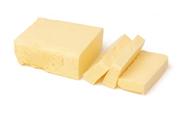Schließen Sie oben auf Block der Butter isoliert