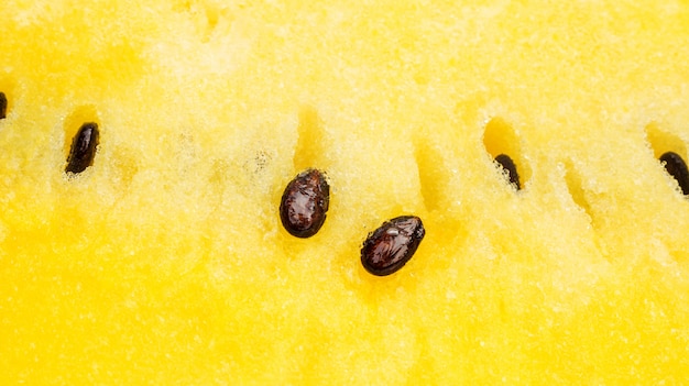 Schließen Sie oben von der gelben Wassermelone für einen Hintergrund.