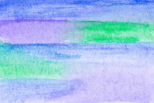 Schmutzige lila grüne und blaue Aquarellmalerei auf Papierhintergrund