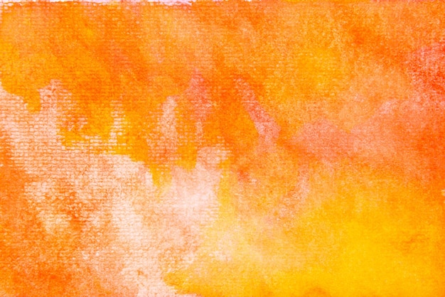 Schmutzige orange und gelbe aquarellmalerei auf papierhintergrund