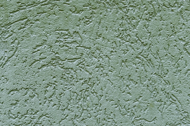Schöne hellgrüne Textur der Betonwand des Hauses