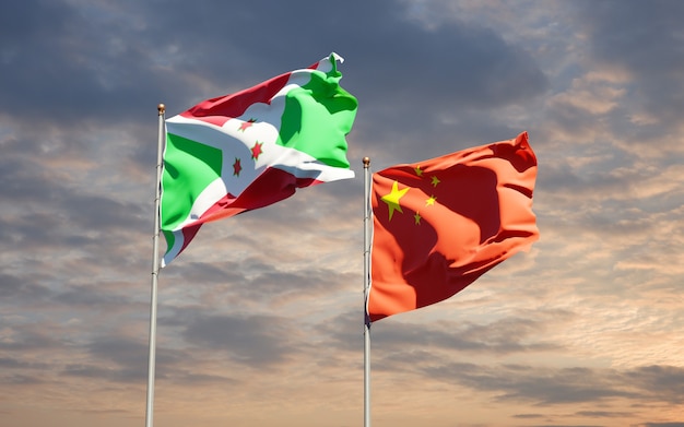 Schöne Nationalstaatsflaggen von China und Burundi zusammen am Himmel