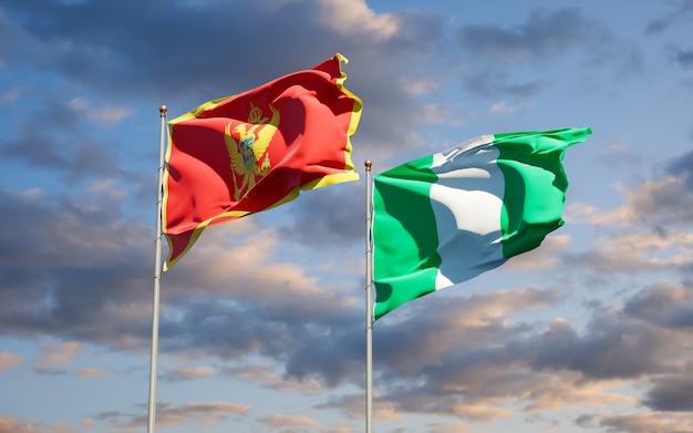 Schöne Nationalstaatsflaggen von Montenegro und von Nigeria zusammen auf blauem Himmel