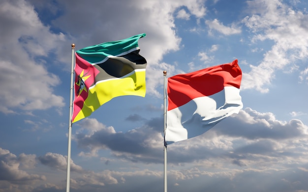 Schöne Nationalstaatsflaggen von Mosambik und Indonesien zusammen auf blauem Himmel