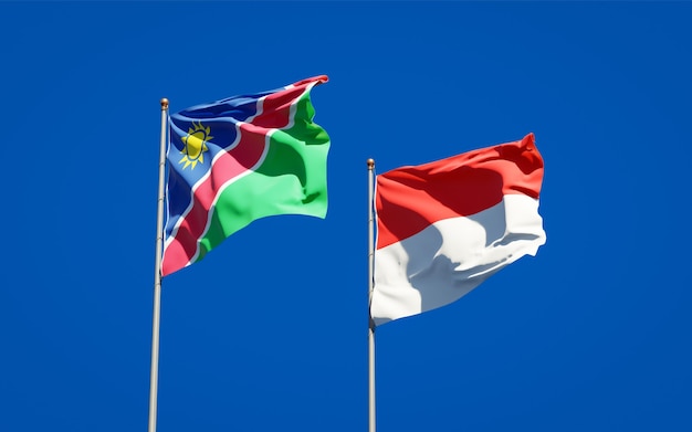 Schöne Nationalstaatsflaggen von Namibia und Indonesien zusammen auf blauem Himmel