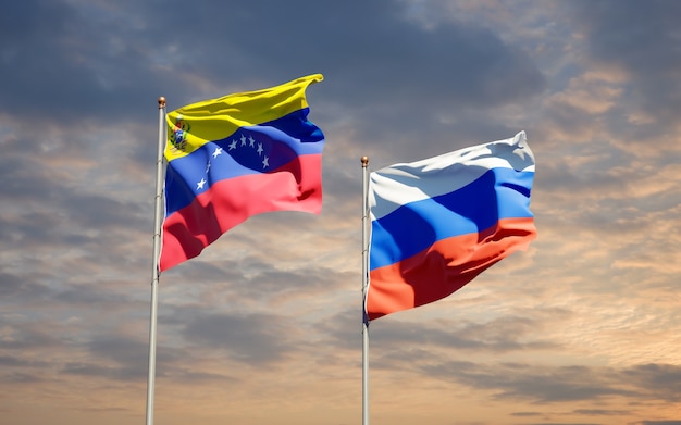 Schöne Nationalstaatsflaggen von Venezuela und Russland zusammen auf blauem Himmel. 3D-Grafik